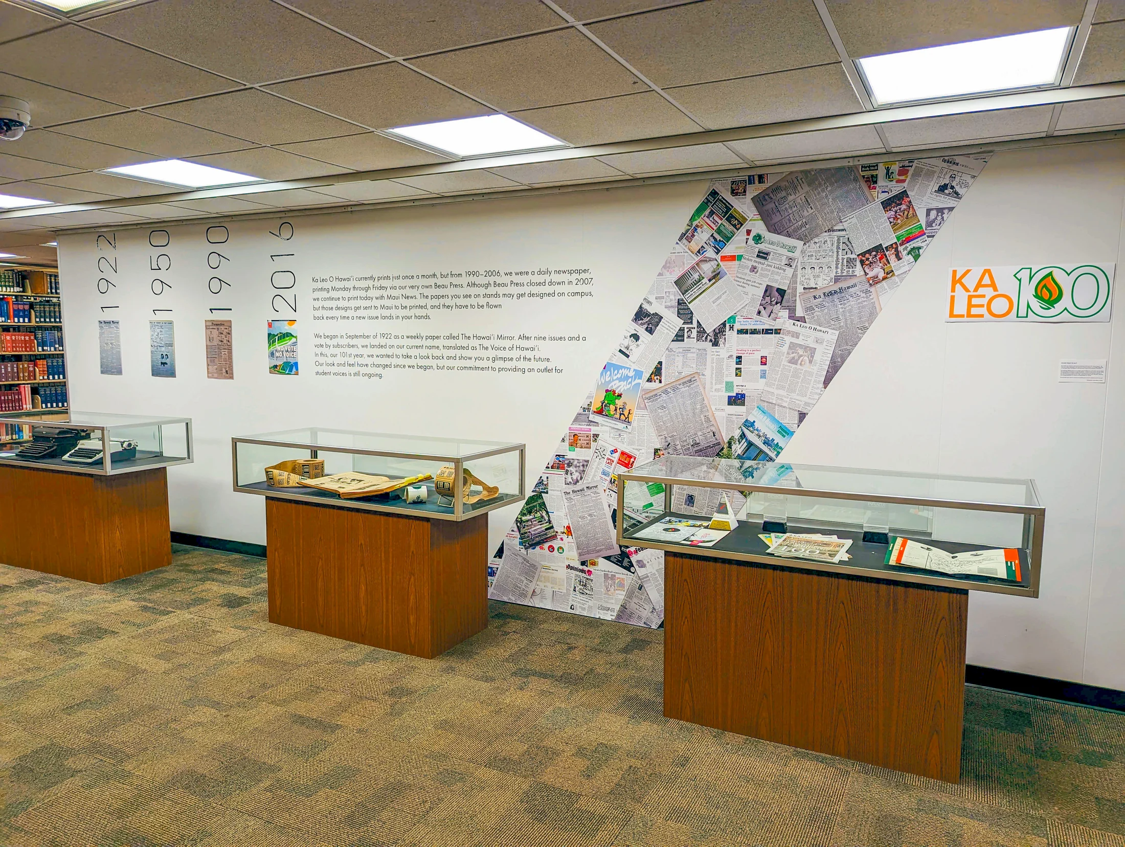 Self-installed Ka Leo centennial exhibition in a gallery room.