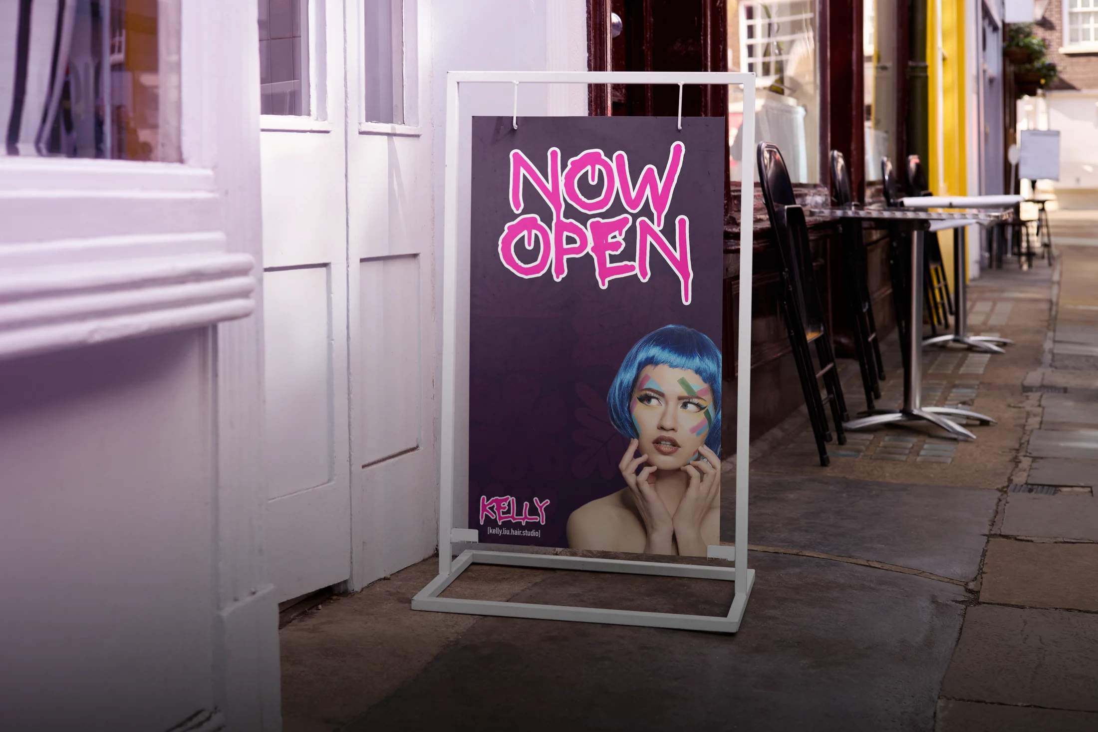 Kelly Lui salon sidewalk sign with a vivid pink identity.
