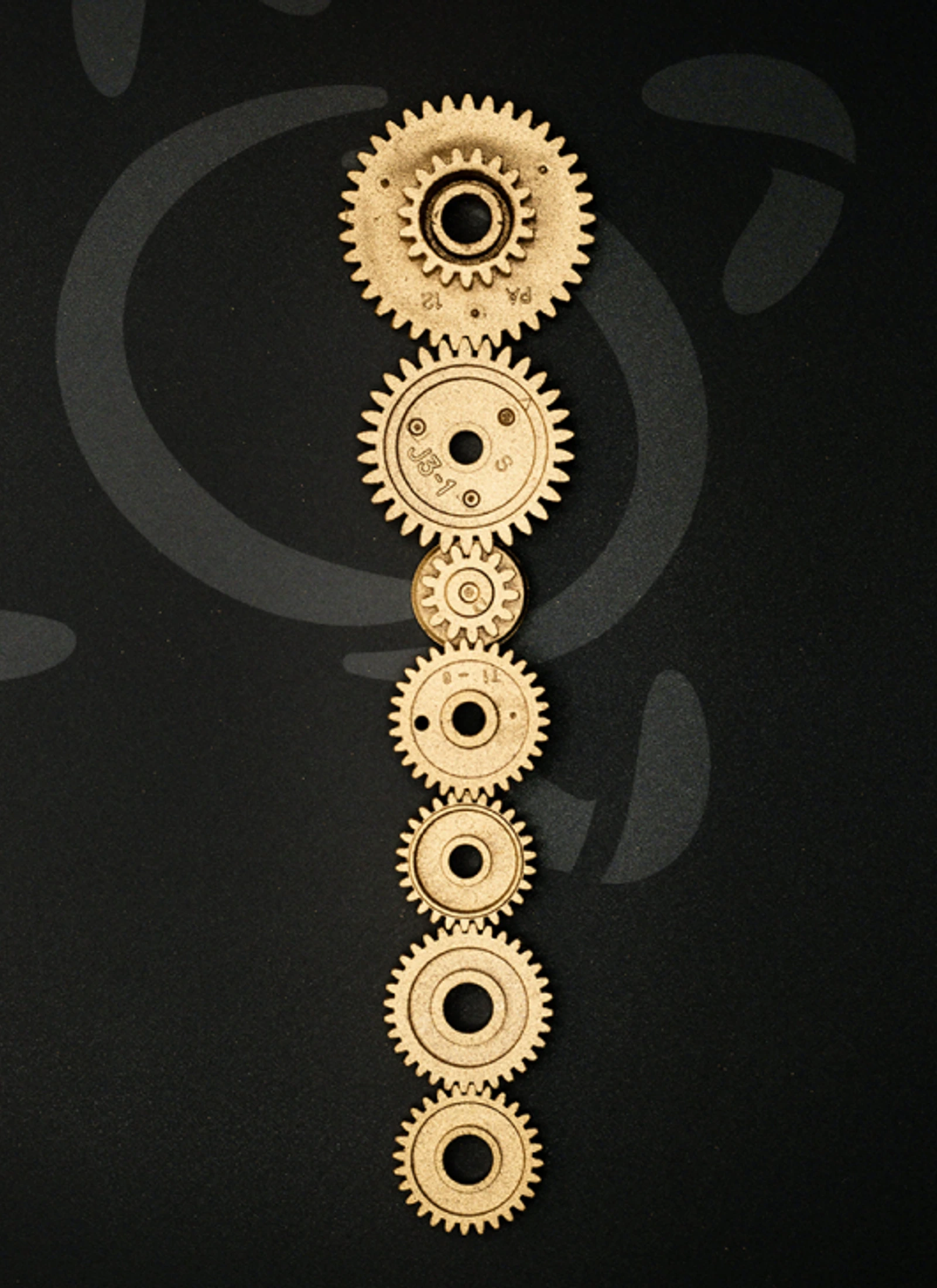 Vertical gold gear-like Rotary symbol study on a dark background.